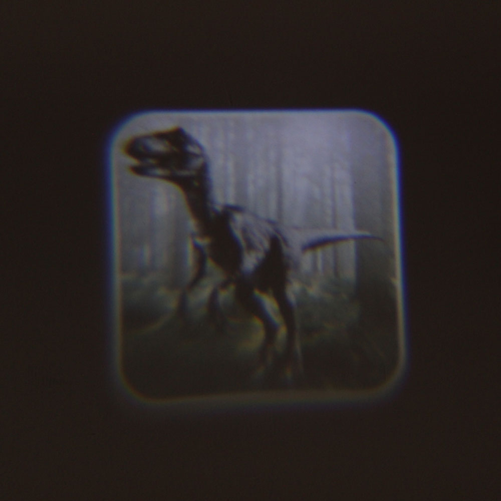 Đồ chơi đèn chiếu vẽ thế giới khủng long